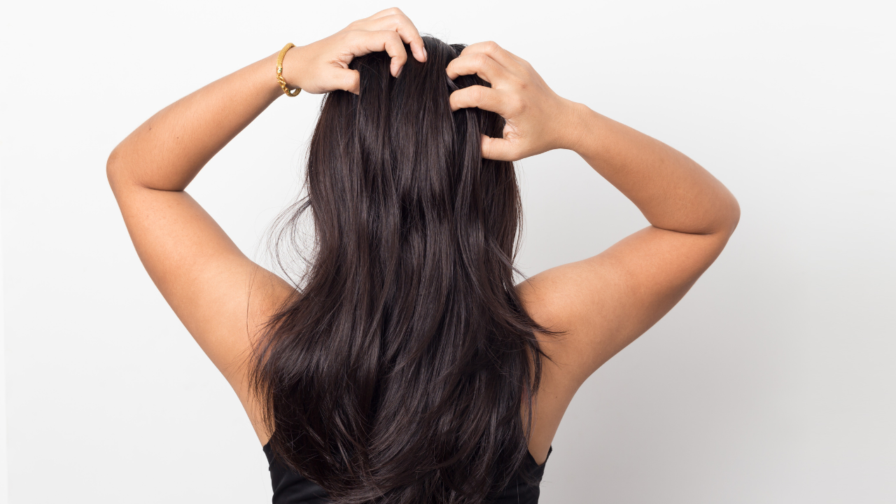 woman running fingers through her hair