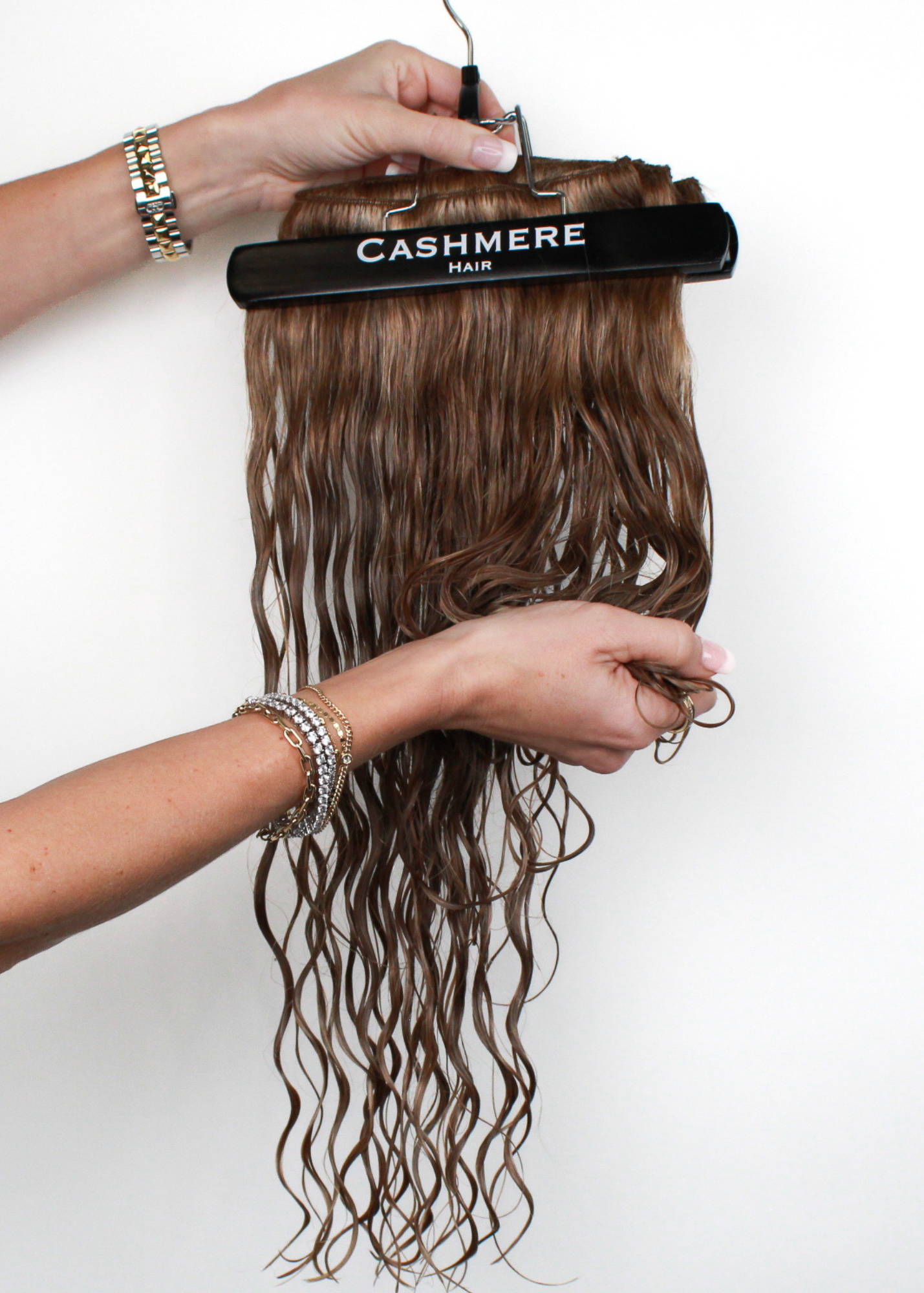 scrunching wet cashmere hair extensions to promote natural waves