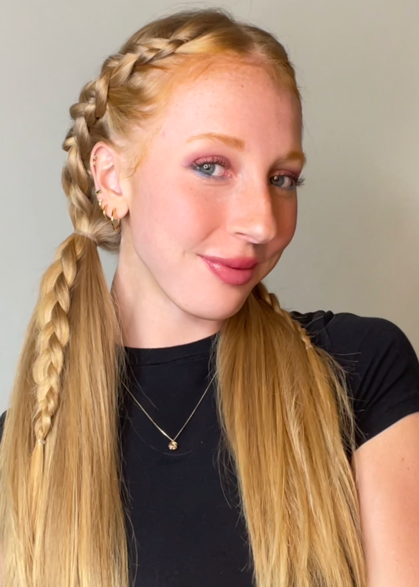 girl wearing cashmere hair seamless extensions with two pigtails and braids