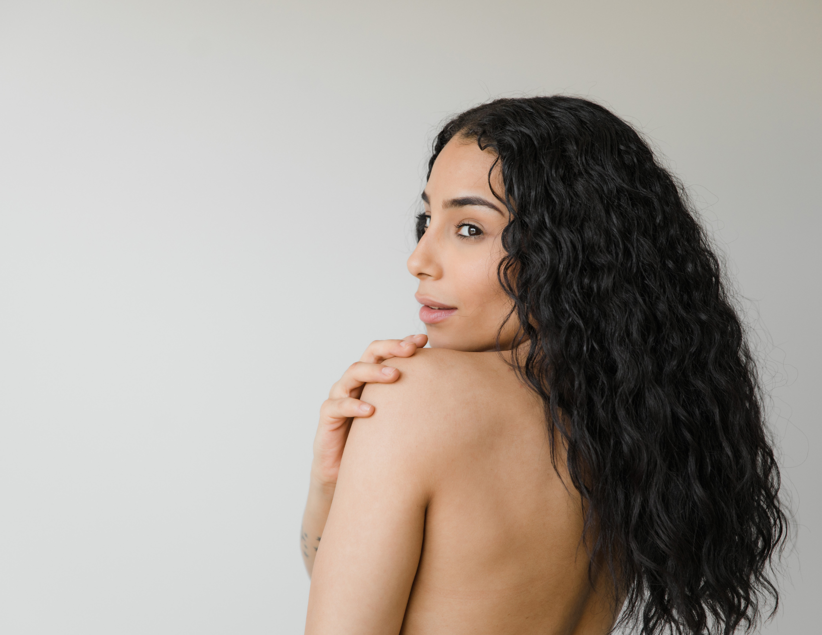 Woman with brown curly hair