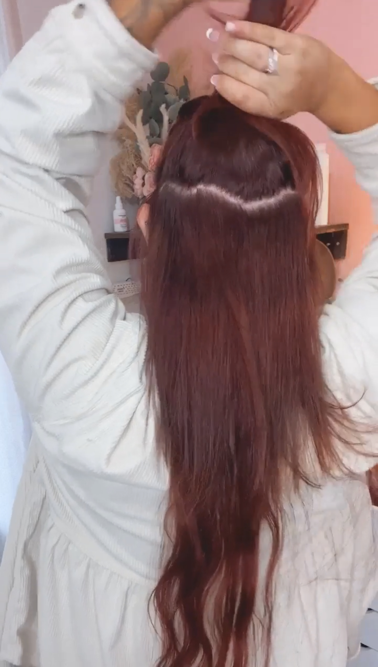 sectioning another layer of hair on top of braided section