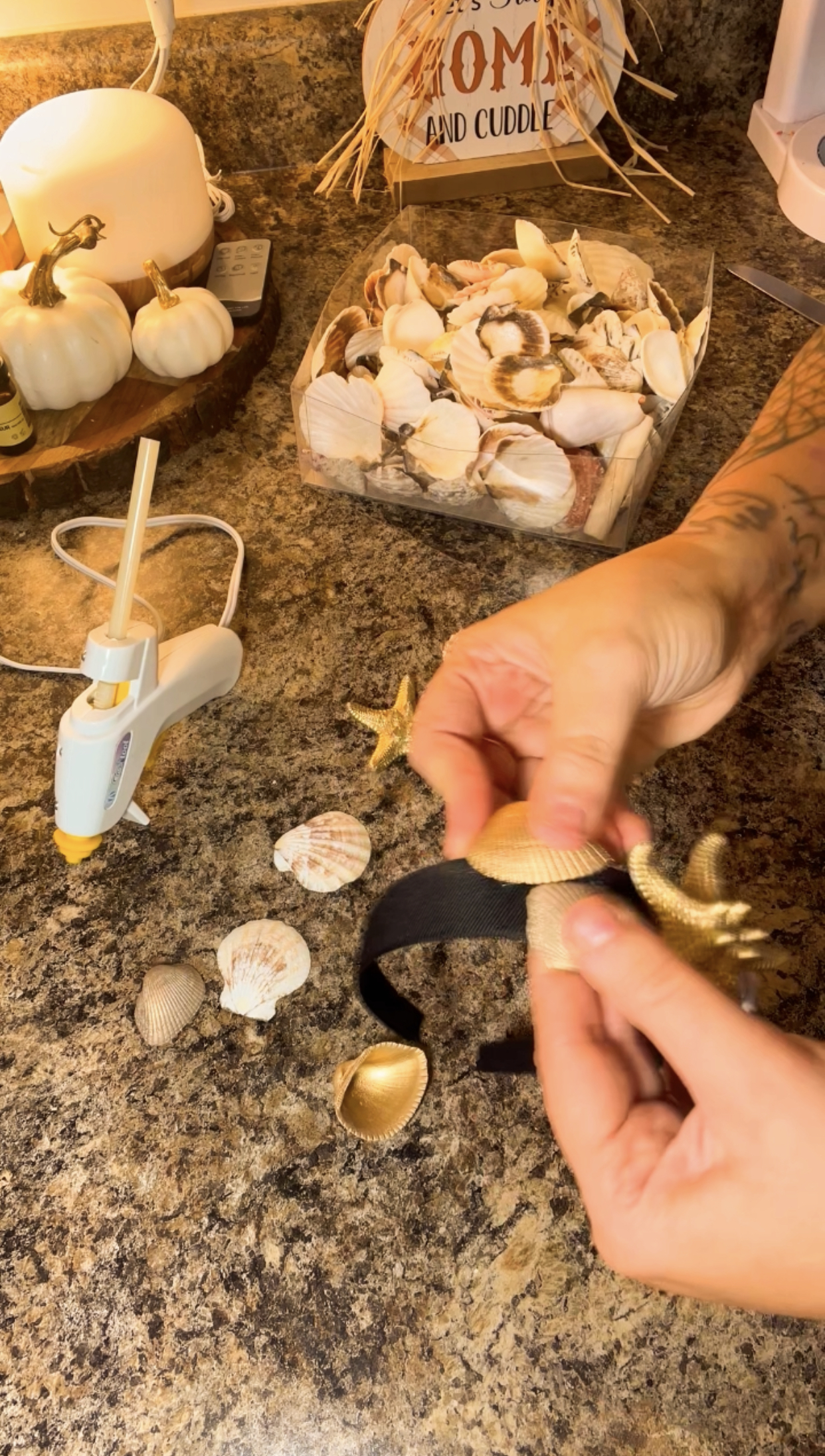 making seashell crown with hot glue gun and headband