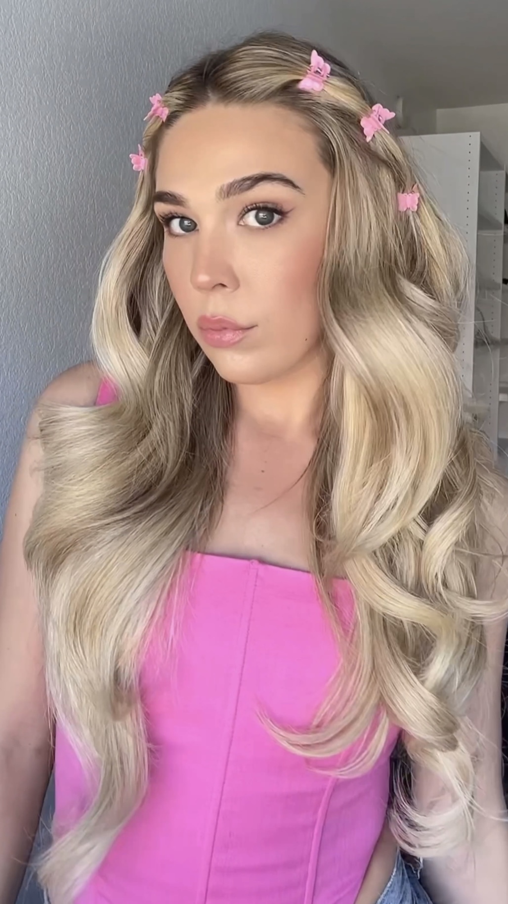 blonde girl with pink butterfly clips in her hair