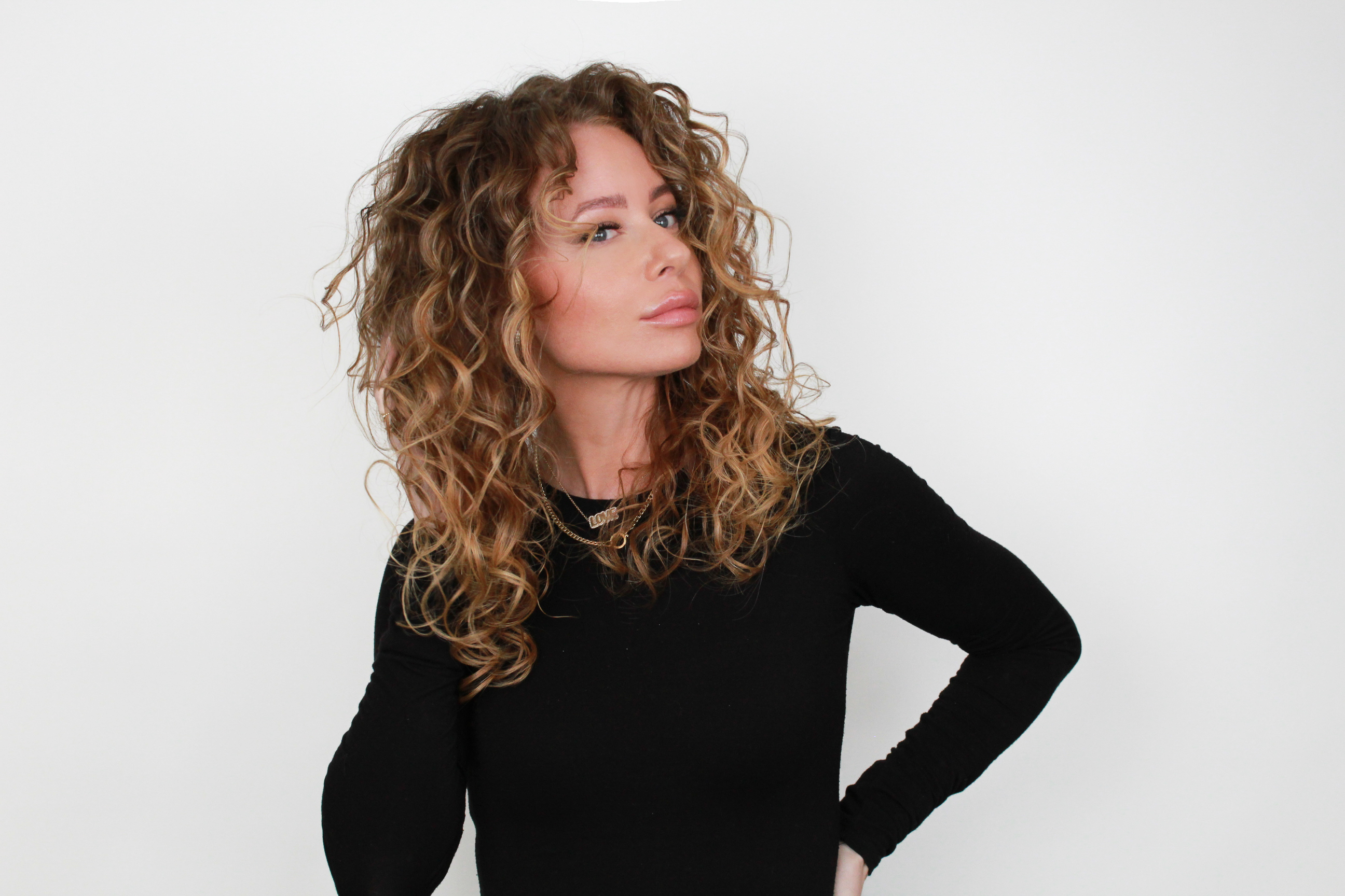 woman showing voluminous soft curls after scrunching out crunch