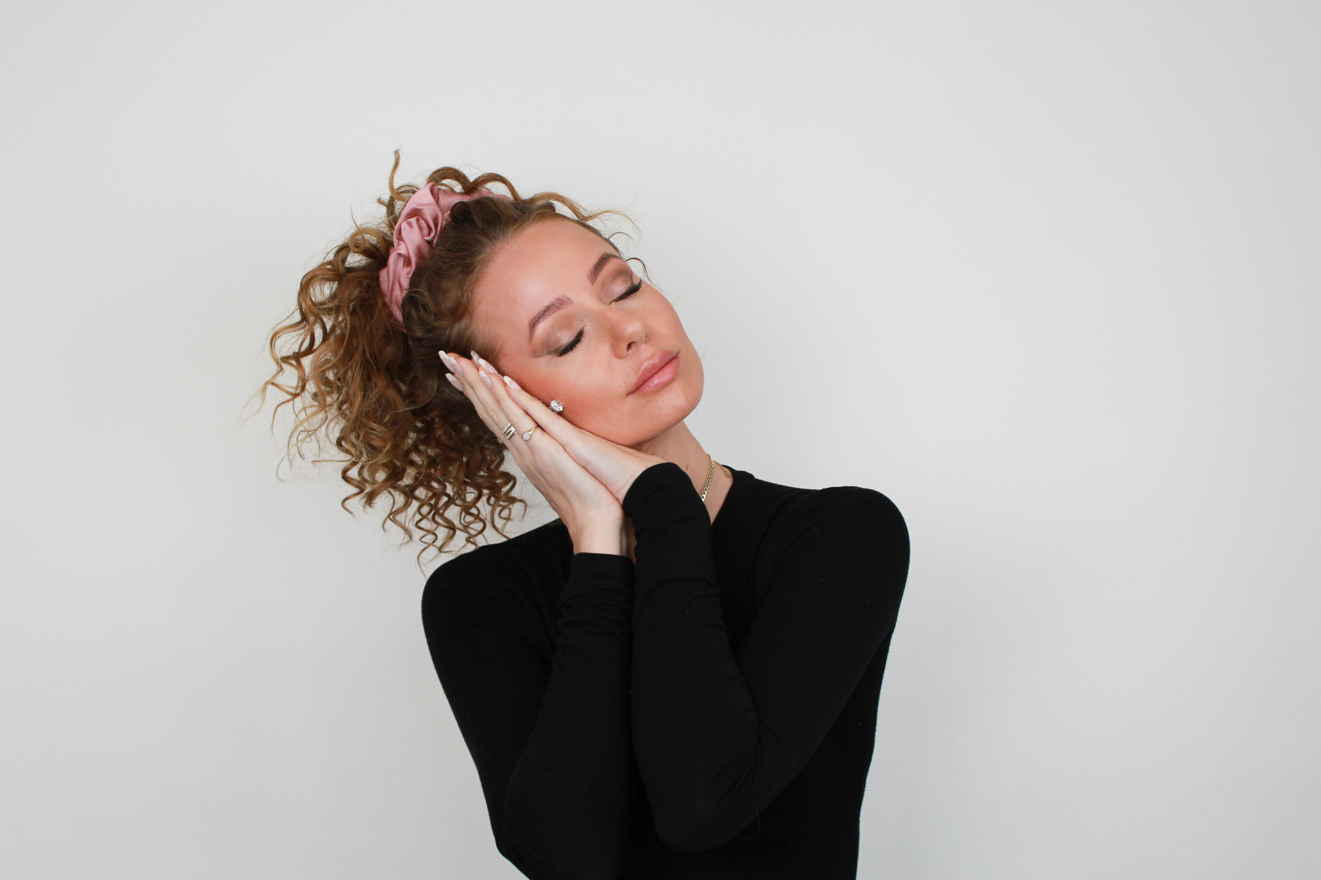 woman demonstrating sleeping with ponytail in