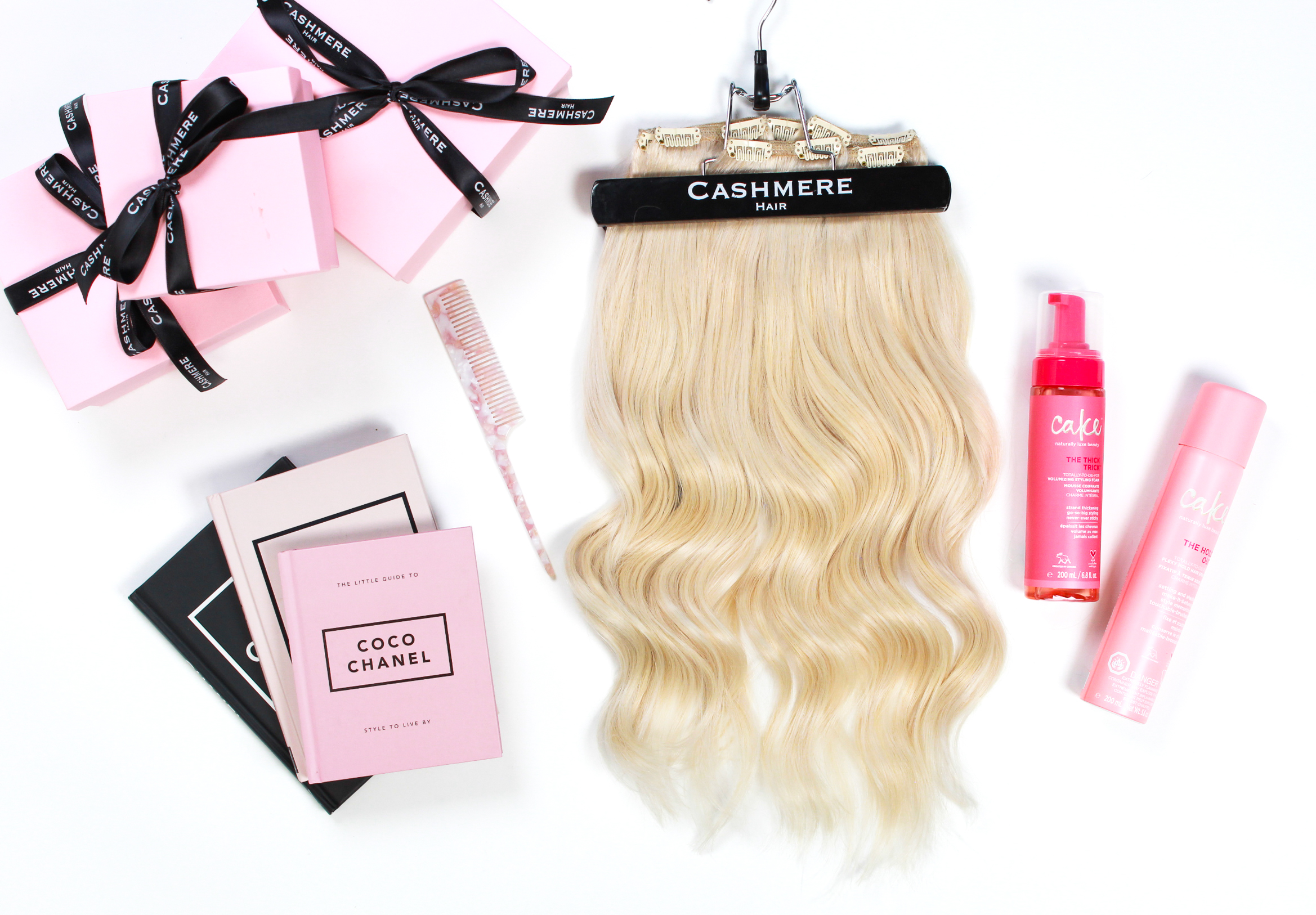Cashmere hair classic clip in extensions, cake beauty products and a wide tooth comb
