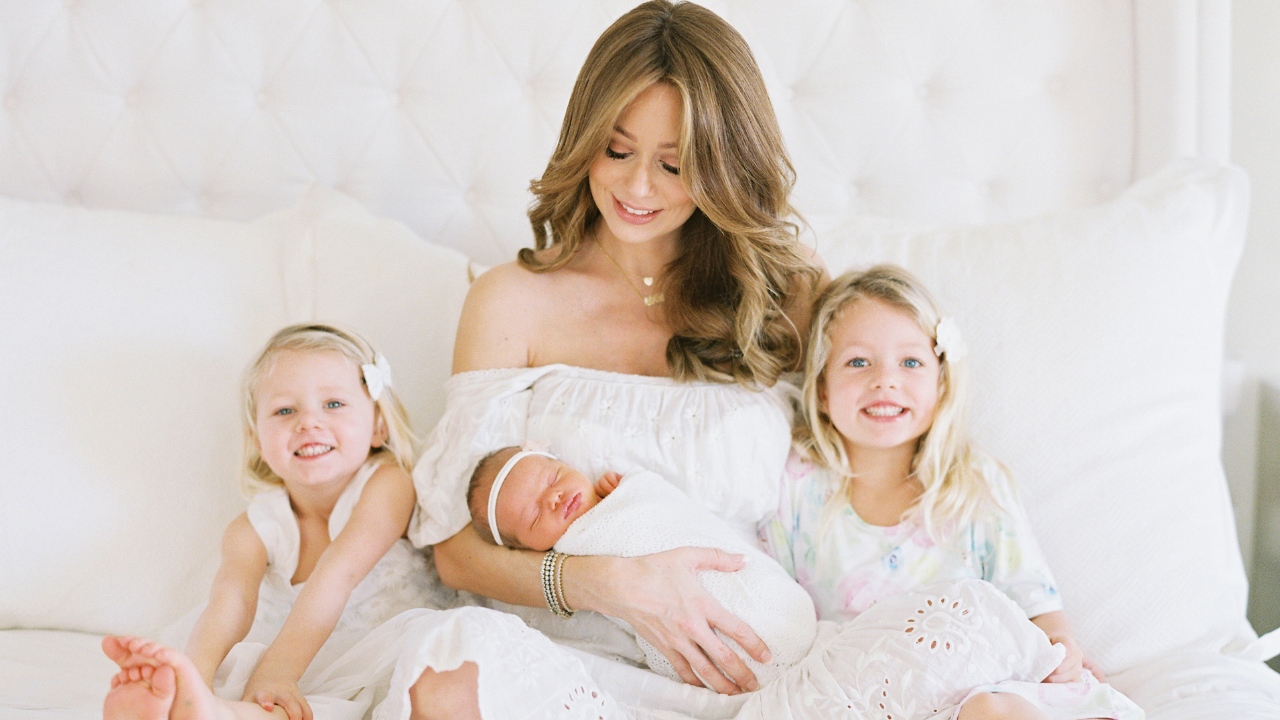 mother with three babies wearing hair extensions